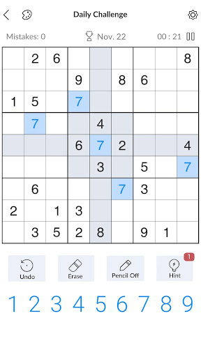 A person deeply focused on solving a captivating Sudoku puzzle, symbolizing the challenge and satisfaction of the game.