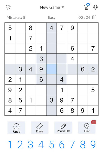 A person deeply focused on solving a captivating Sudoku puzzle, symbolizing the challenge and satisfaction of the game.