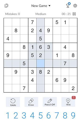 A person deeply focused on solving a captivating Sudoku puzzle, symbolizing the challenge and satisfaction of the game.