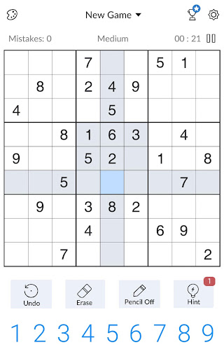 A person deeply focused on solving a captivating Sudoku puzzle, symbolizing the challenge and satisfaction of the game.