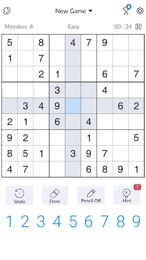 A person deeply focused on solving a captivating Sudoku puzzle, symbolizing the challenge and satisfaction of the game.