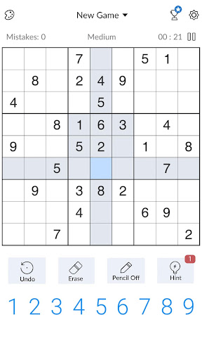 A person deeply focused on solving a captivating Sudoku puzzle, symbolizing the challenge and satisfaction of the game.