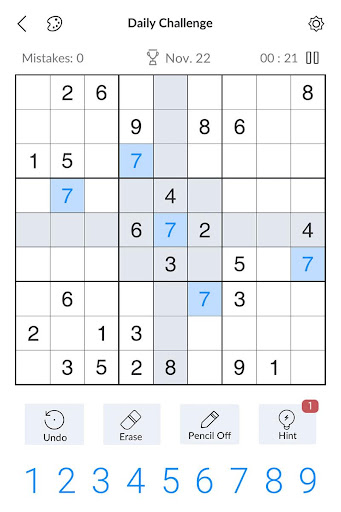 A person deeply focused on solving a captivating Sudoku puzzle, symbolizing the challenge and satisfaction of the game.