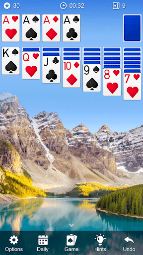 A person enthusiastically playing a game of solitaire, feeling a sense of nostalgia and excitement as they engage with a classic Klondike card game on their smartphone.