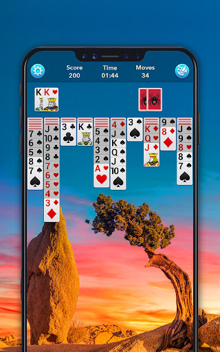 A person immersed in playing Spider Solitaire, with a look of concentration and enjoyment, symbolizing the blend of challenge and relaxation the game offers.