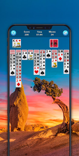 A person immersed in playing Spider Solitaire, with a look of concentration and enjoyment, symbolizing the blend of challenge and relaxation the game offers.